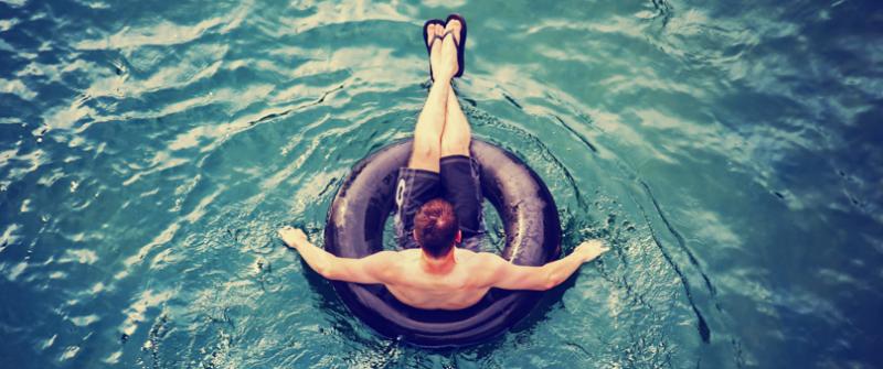Tubing Man Photo of a man floating on an inner tube.